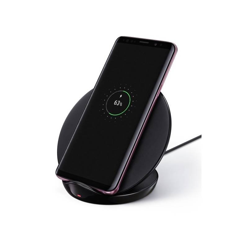 A smartphone, showing a 63% battery and charging icon, stands vertically on the Samsung Wireless 15W Fast Charger Price in Pakistan, which is connected by a cable. A smartphone, showing a 63% battery and charging icon, stands vertically on the Samsung Wireless 15W Fast Charger Price in Pakistan, which is connected by a cable.